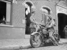 A_motorcycle_despatch_rider_delivers_a_message_to_the_signals_office_of_1st_Border_Regiment_a...webp A_motorcycle_despatch_rider_delivers_a_message_to_the_signals_office_of_1st_Border_Regiment_a...webp