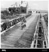 a-despatch-rider-crosses-multiple-bailey-bridges-in-holland-while-performing-military-deliver...webp